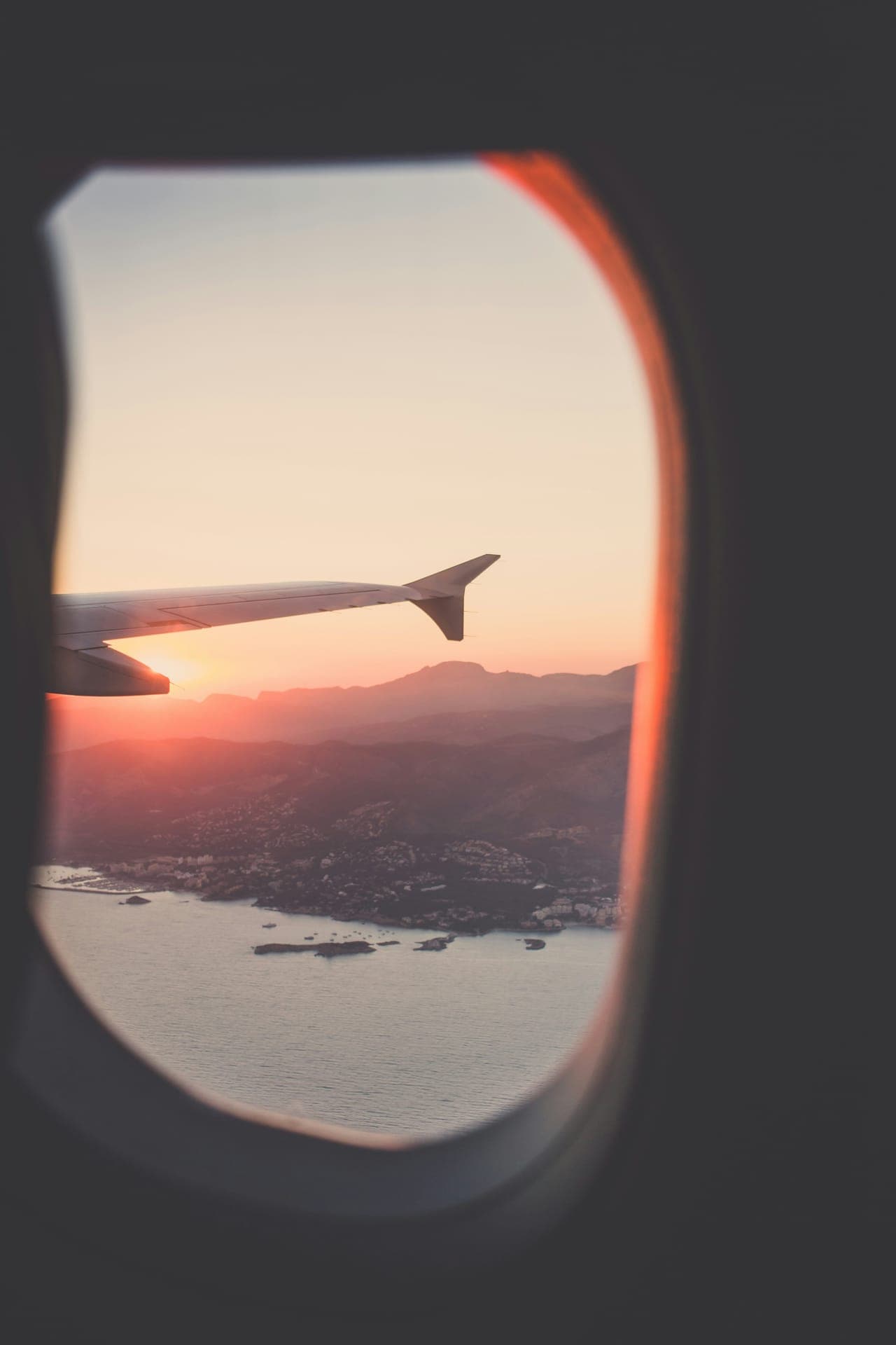 View from an airplane window over the Mediterranean coast